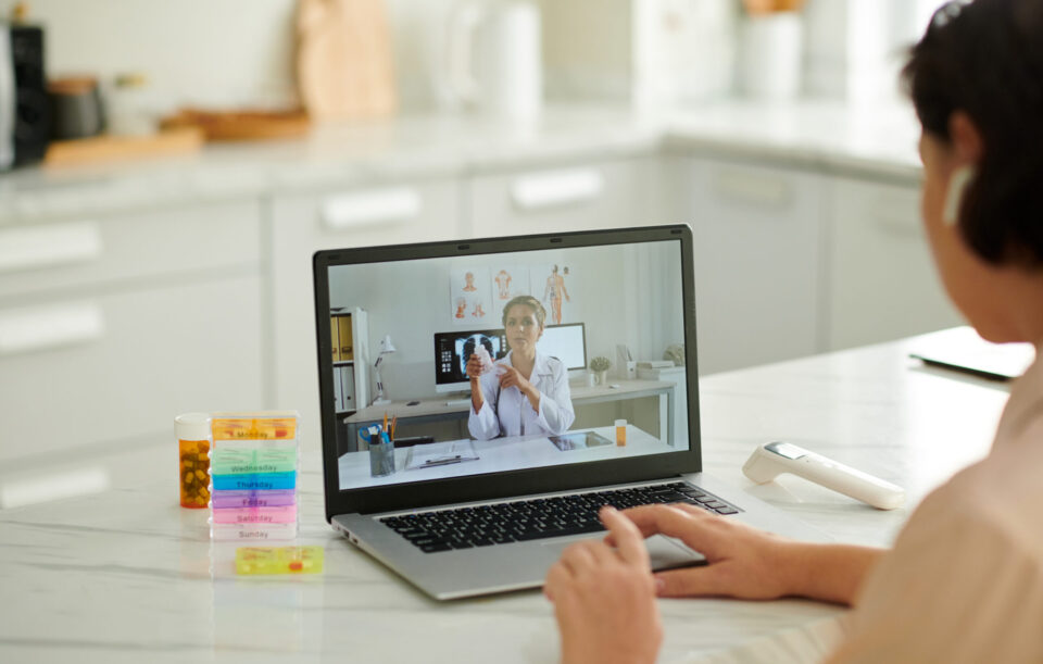 Doctor recommending new medicine to patient during telemedicine session